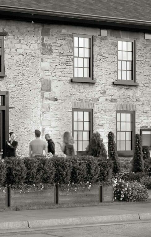 black white exterior photo of Greystones