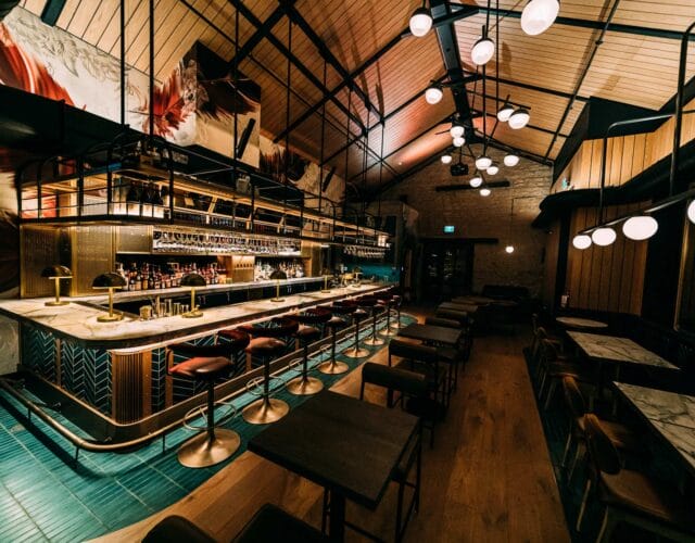 Stylish restaurant bar with seating and ambient lighting