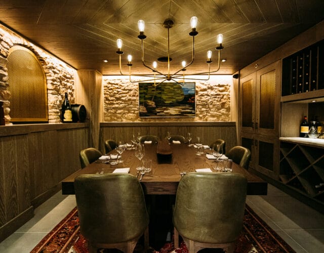 private dining space with wood ceiling and lighting